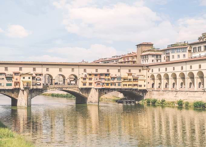 Florence, Italy I Pastel Ponte Vecchio on Arno to experience dolce vita in Tuscany in sunny to retro vintage atmospherewith an Italian summer yellow sunny aesthetic like an old Mediterranean village