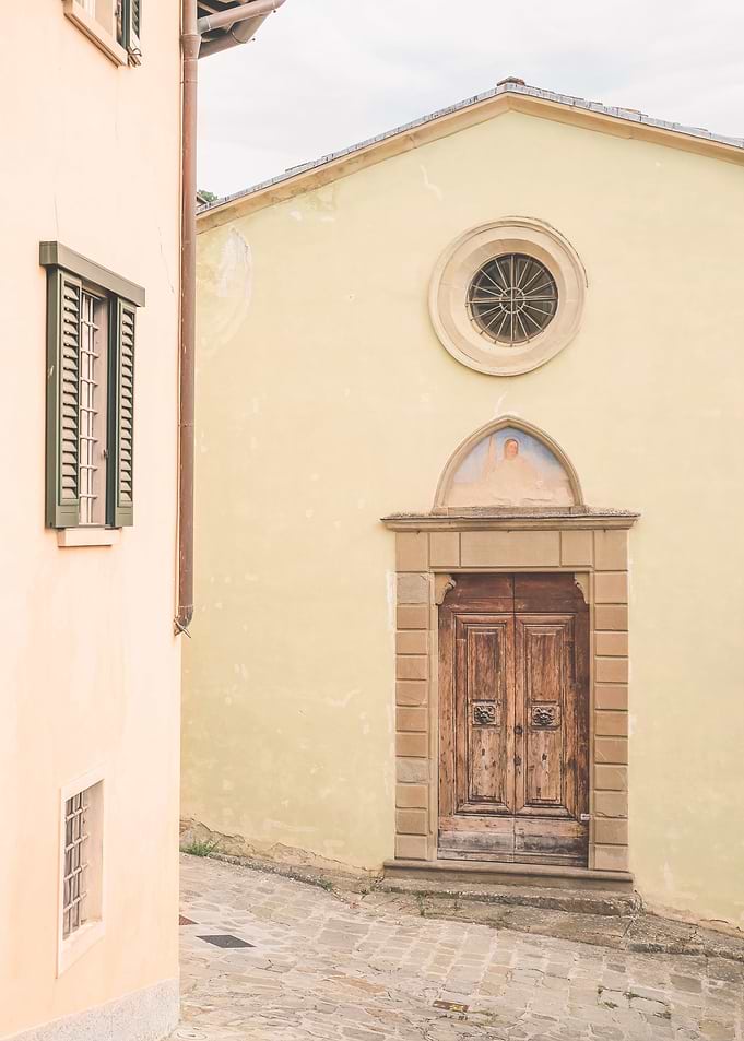 Florence, Italy I Vintage pastel door at church in the streets of the Tuscan countryside italian village of Fiesole to enjoy La Dolce Vita in Rome, Venice or Naples with a retro vintage aesthetic