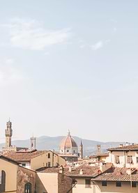 Florence, Italy I Skyline view of italian rooftops and Duomo Santa Maria del Fiore cathedral church with summer pastel aesthetic in sunny orange tones for living la dolce vita under the sun blue sky