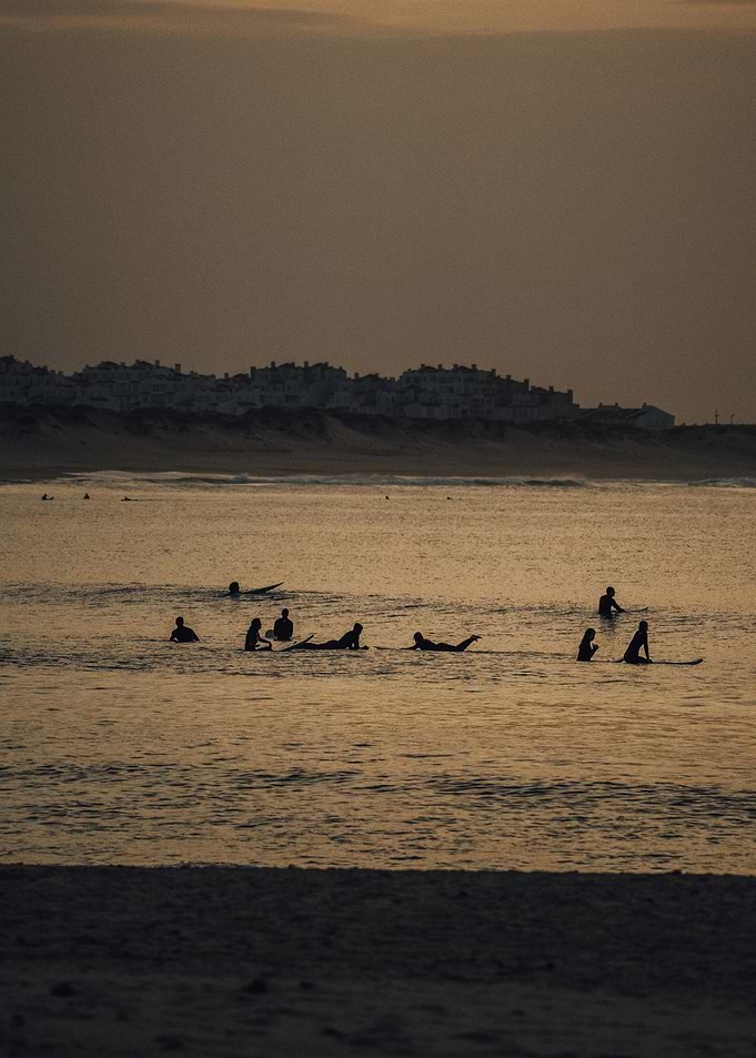 Silhouettes of Surfers at Sunset in Baleal Portugal OU