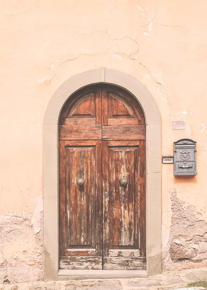 Florence, Italy I A retro vintage wooden door with an orange aesthetic in italian alleyways streets from village Fiesole in Tuscany or in Rome, Venice or Naples city for a minimalist geometric decor