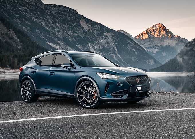 Blue SUV in Mountain Landscape