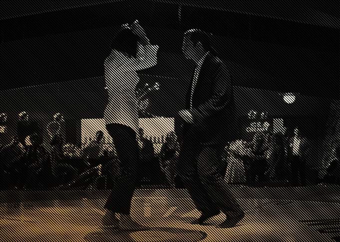 Silhouette of Two People Dancing