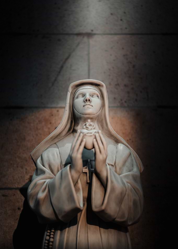 Nun Statue with Heart
