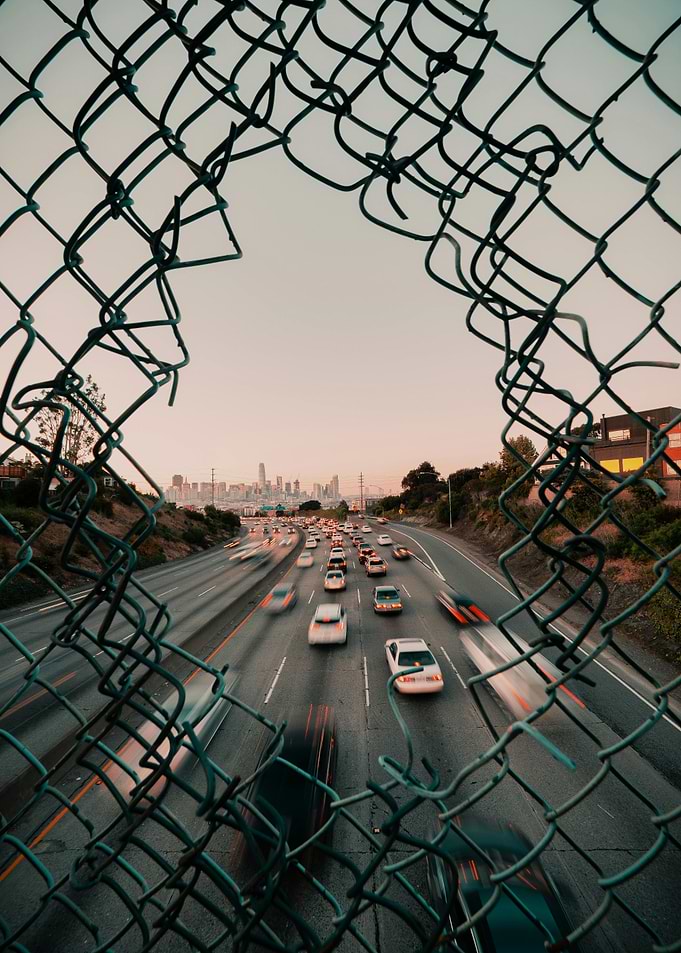 Cityscape Through Fence