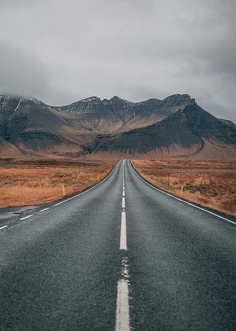 Empty Road Through Mountains