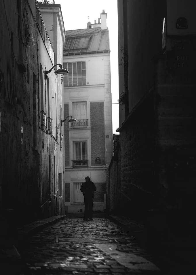 Solitary Figure in Narrow Alley