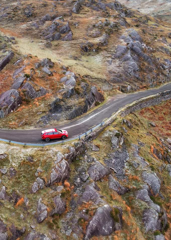Red Car on Winding Road