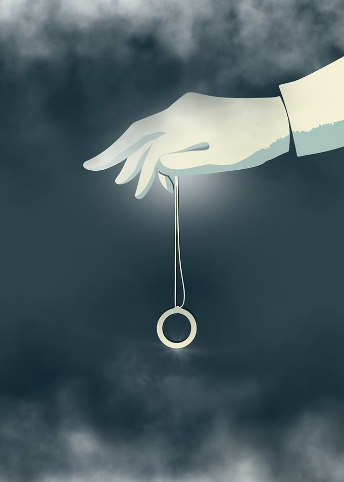 Hand Holding a Ring