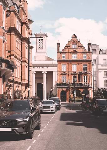 London, England I London Victorian architecture urban cityscape in Mayfair street with Bridgerton with British charm and the classic retro vintage atmosphere aesthetic of red brick city facades