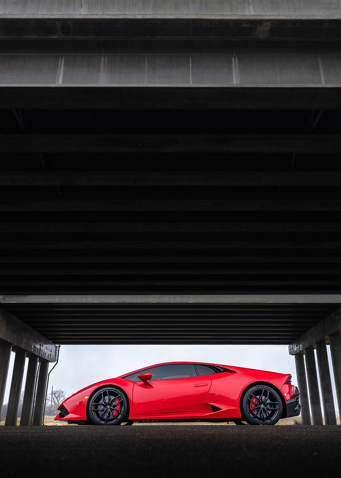 Red Lamborghini Huracan Under Bridge
