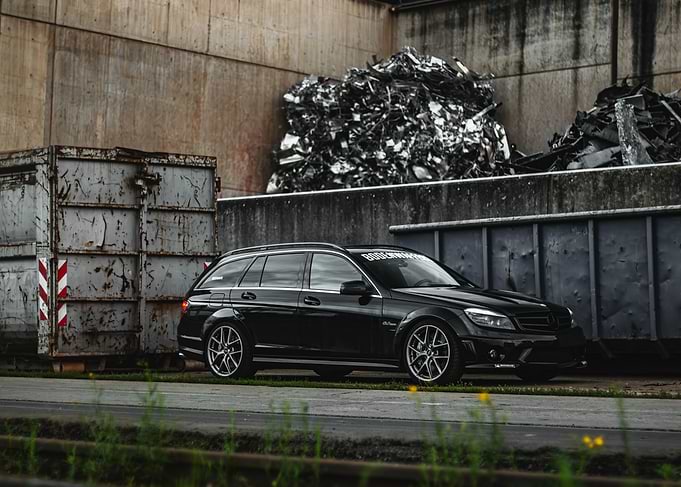 Black Mercedes C63 Wagon in Industrial area