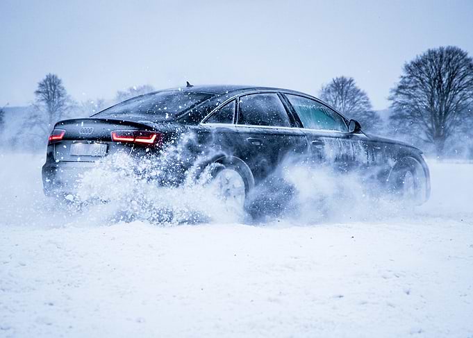 Black Audi in Snow