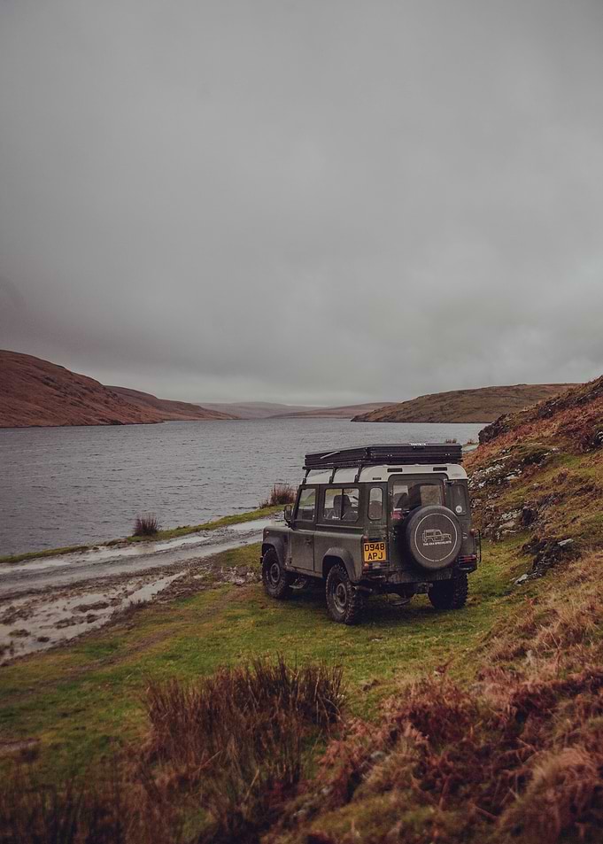 Green Land Rover by the Lake