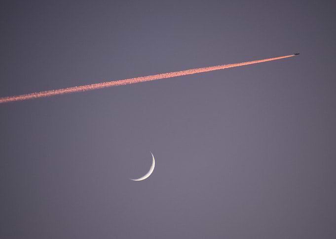 Crescent Moon and Airplane Trail
