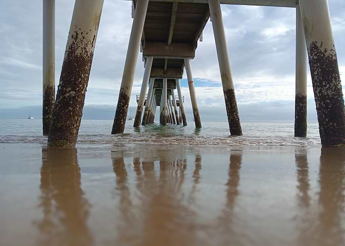 Pier Supports on Sandy Beach