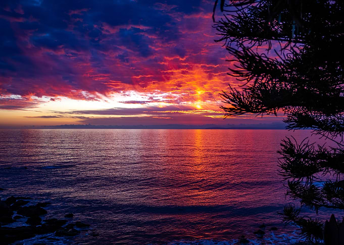 Fiery Sunset Over Ocean