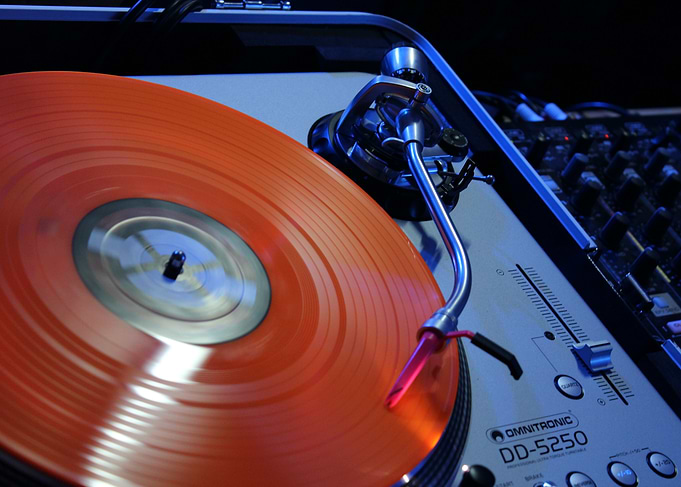 Red Vinyl Record on Turntable