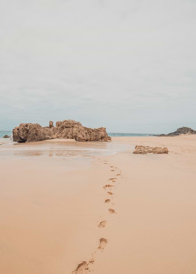 Footprints on Sandy Beach