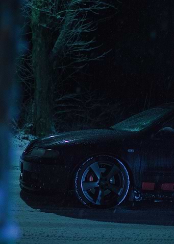 Black Car in Snowy Night