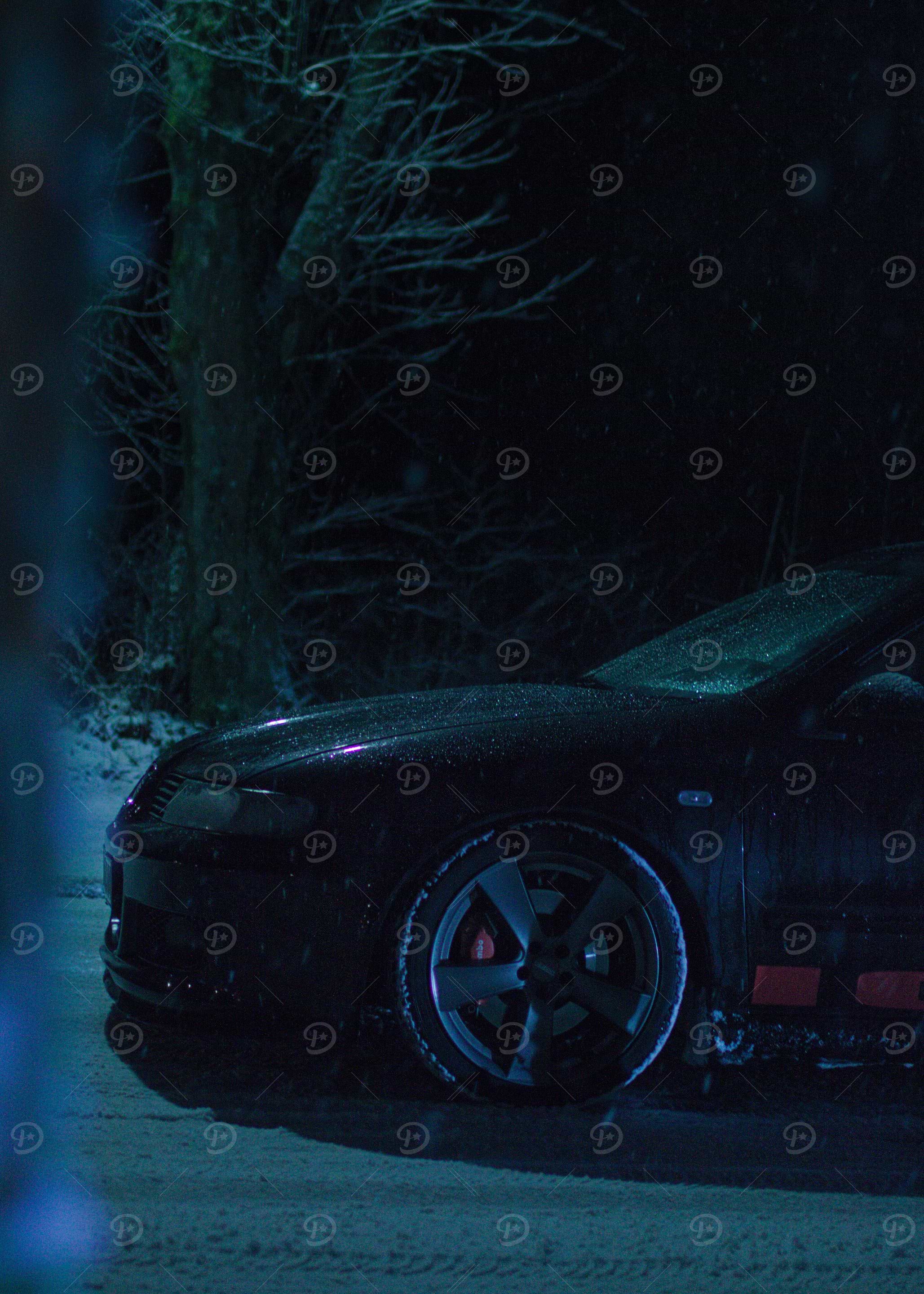 Black Car in Snowy Night