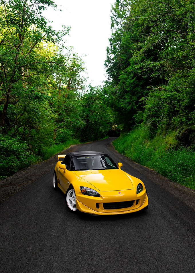 Yellow Honda S2000 on Winding Road