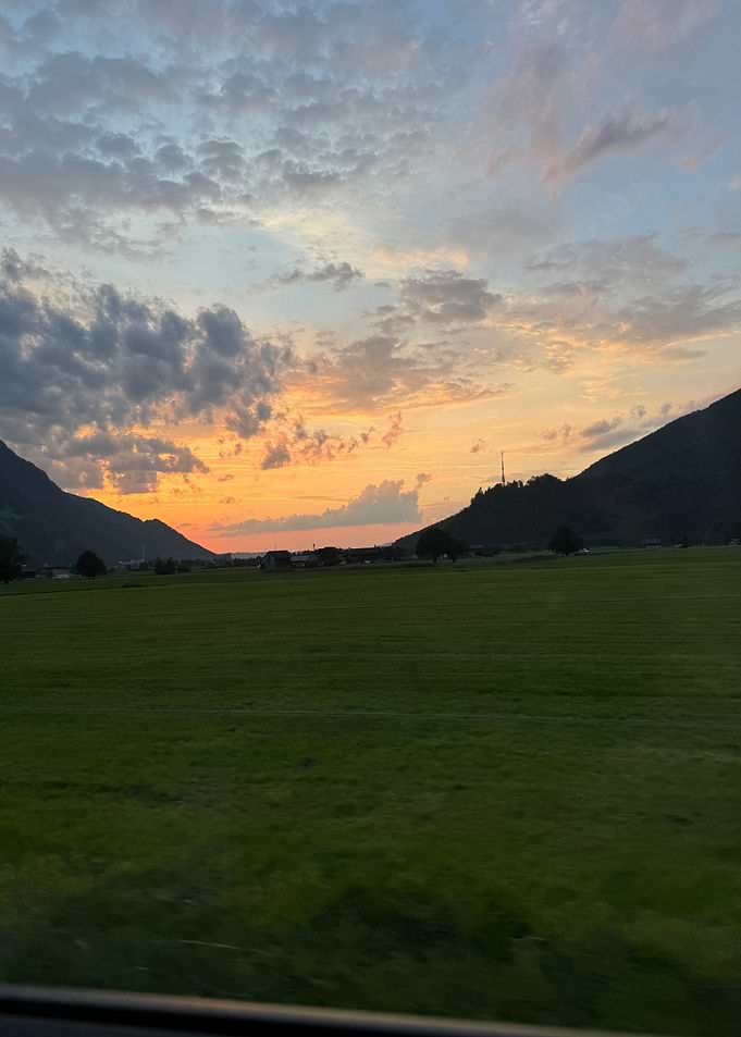 Sunset Over Green Fields