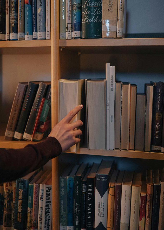 Hand Reaching for Book