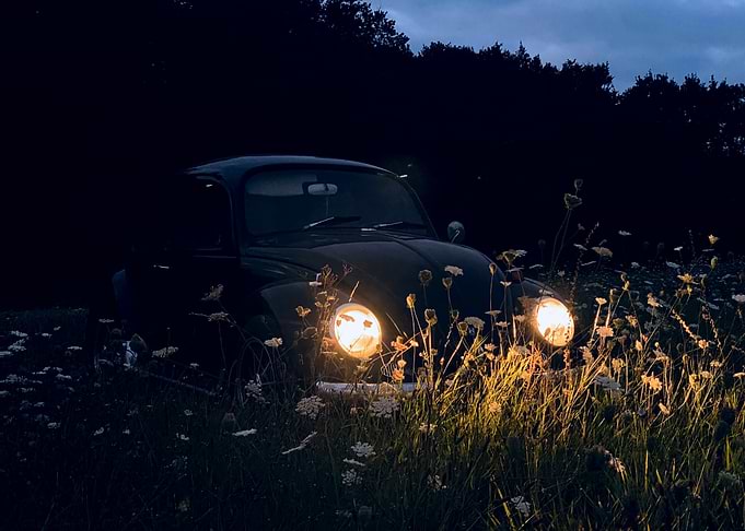 Vintage Car in Field at Night