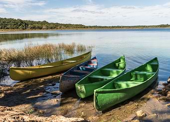Colorful Canoes by the Lake
