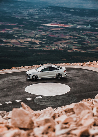 White Audi RS3 on Mountain Road