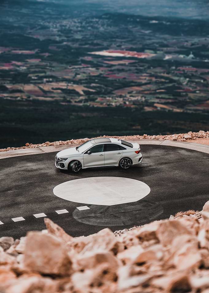 White Audi RS3 on Mountain Road