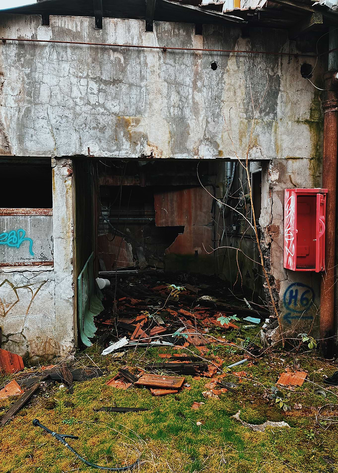 Abandoned Building Exterior with Graffiti during Urbex