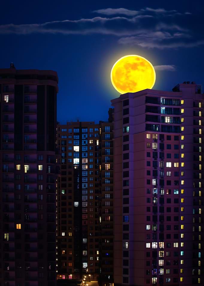 Full Moon Over Cityscape