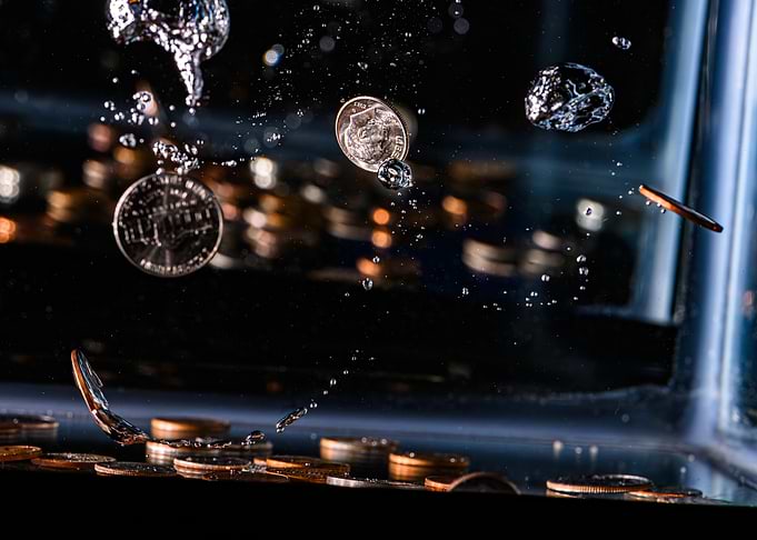 Coins Dropping in Water