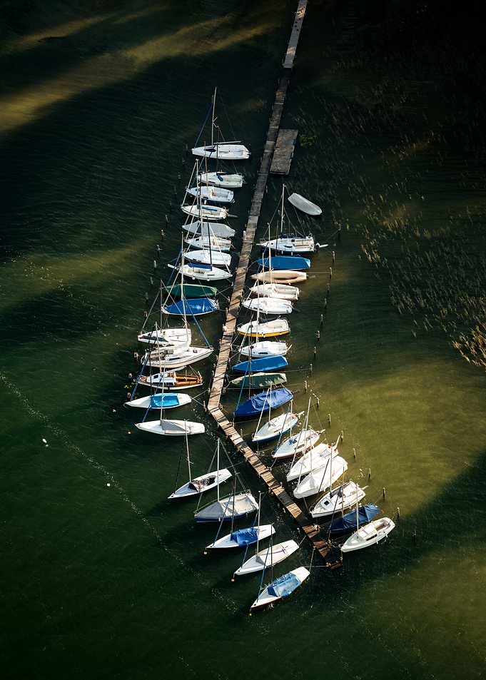 Sailboats Docked at Pier