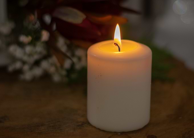 Burning Candle with Flowers