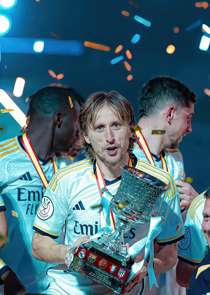 real madrid Soccer Player Holding Trophy