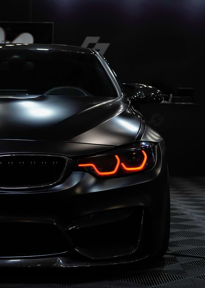 Black BMW M4 with Red Lights