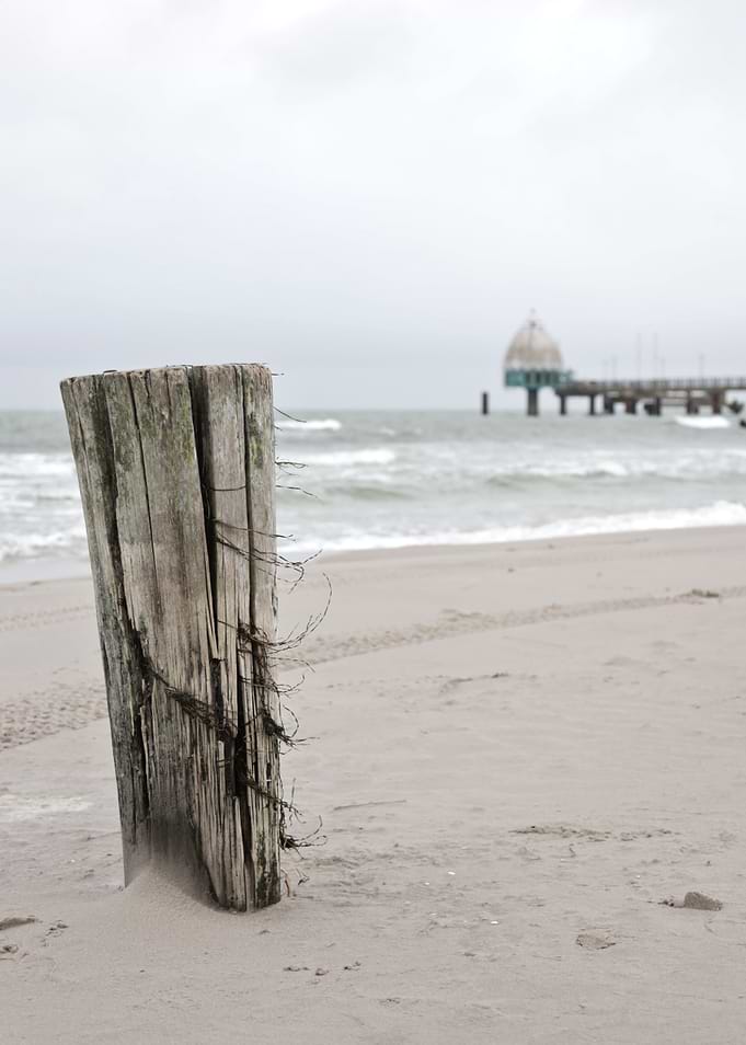 Weathered Wooden Post on Beach