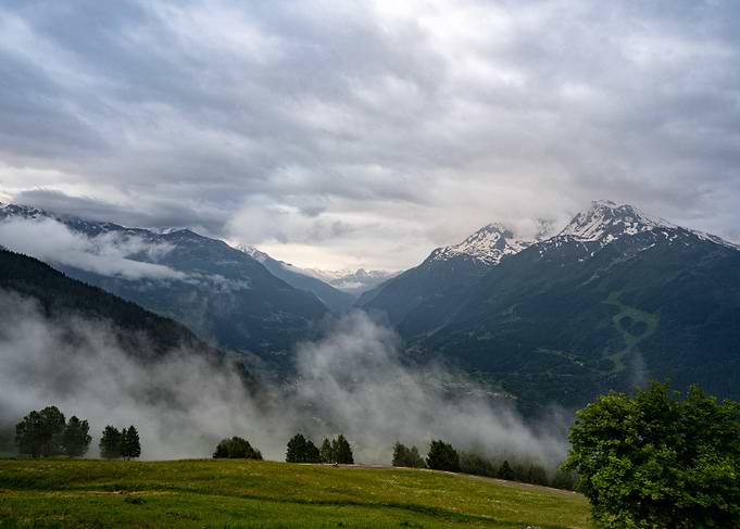 Misty Mountain Valley and alone cyclist