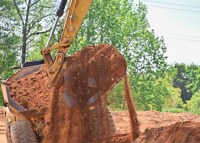 Excavator Dumping Dirt