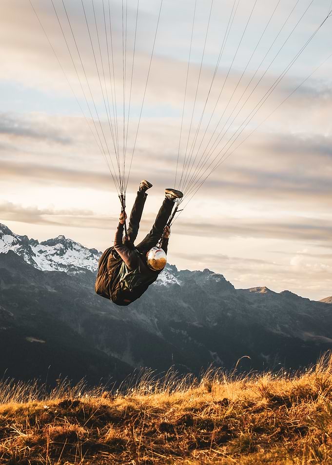 Paraglider Over Mountains