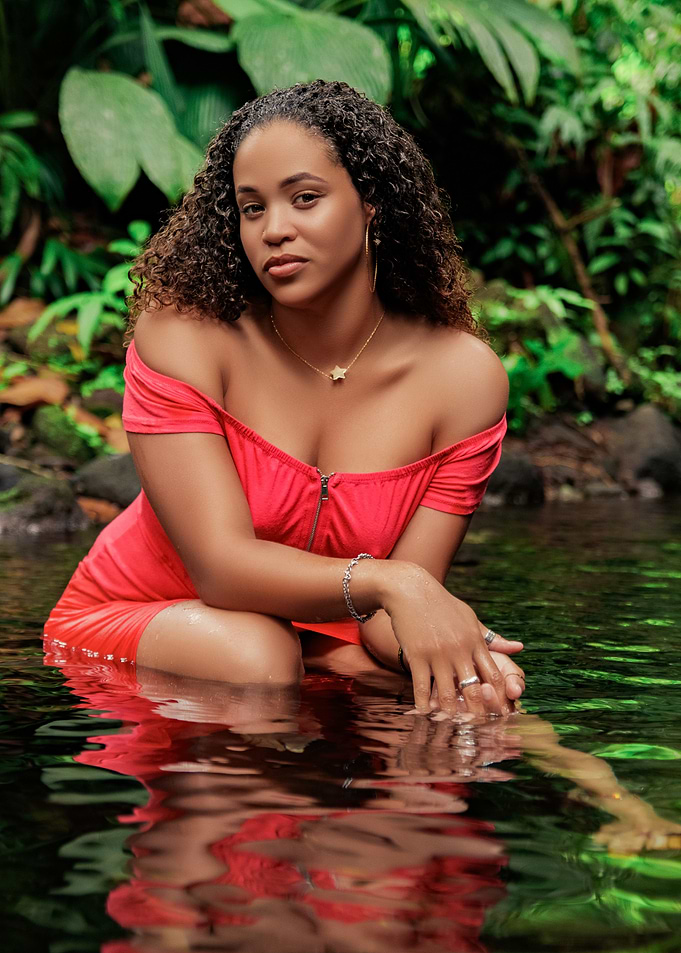 Woman in Red Dress by Water