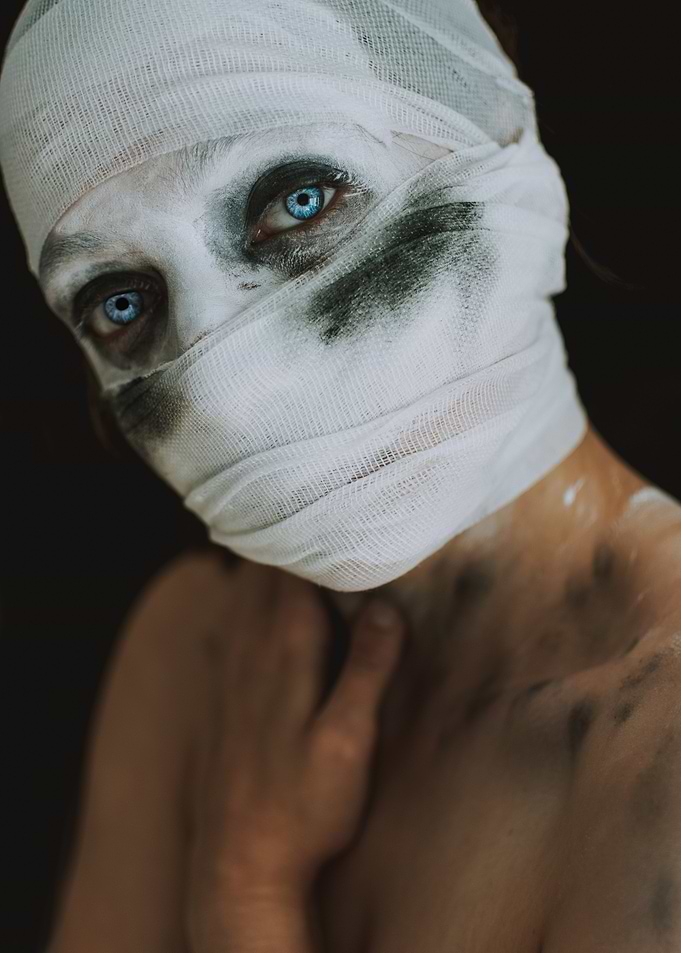 Bandaged Face with Blue Eyes