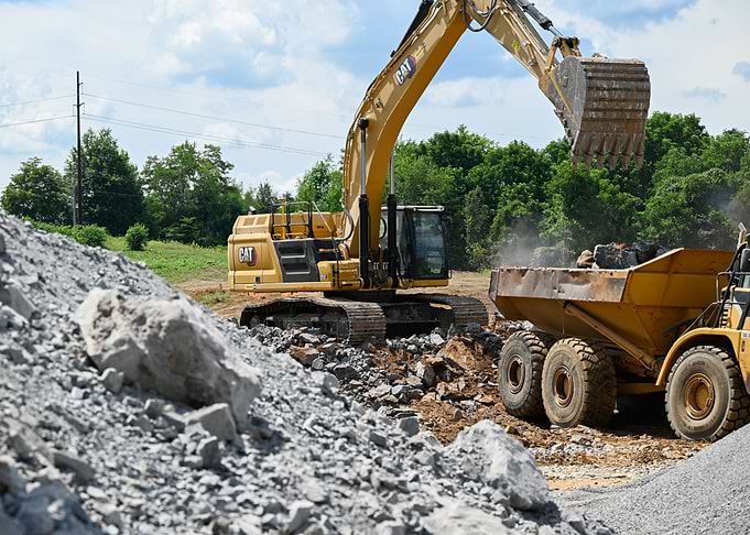 Caterpillar Excavator Loading Dump Truck