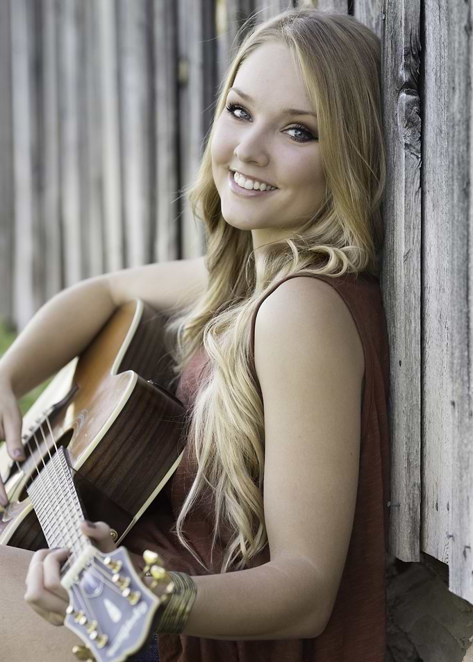 Smiling Woman with Guitar