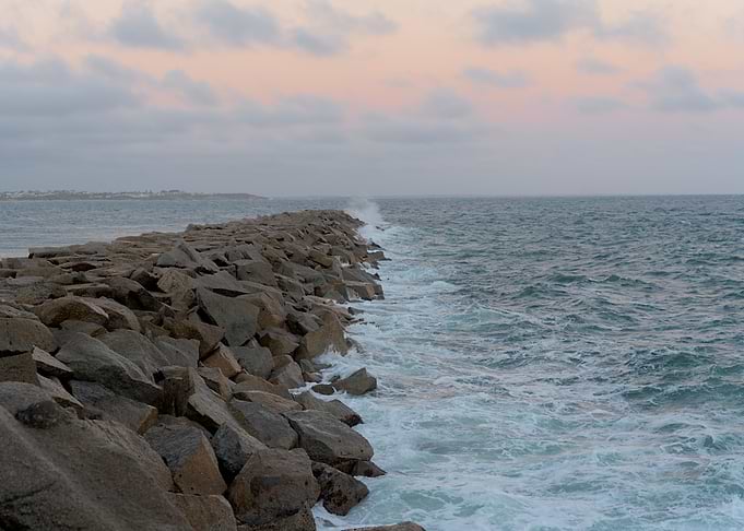 Rocky Breakwater at Sunset