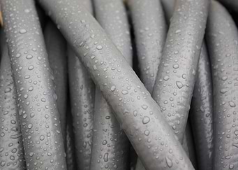 Gray Water Hose In The Rain