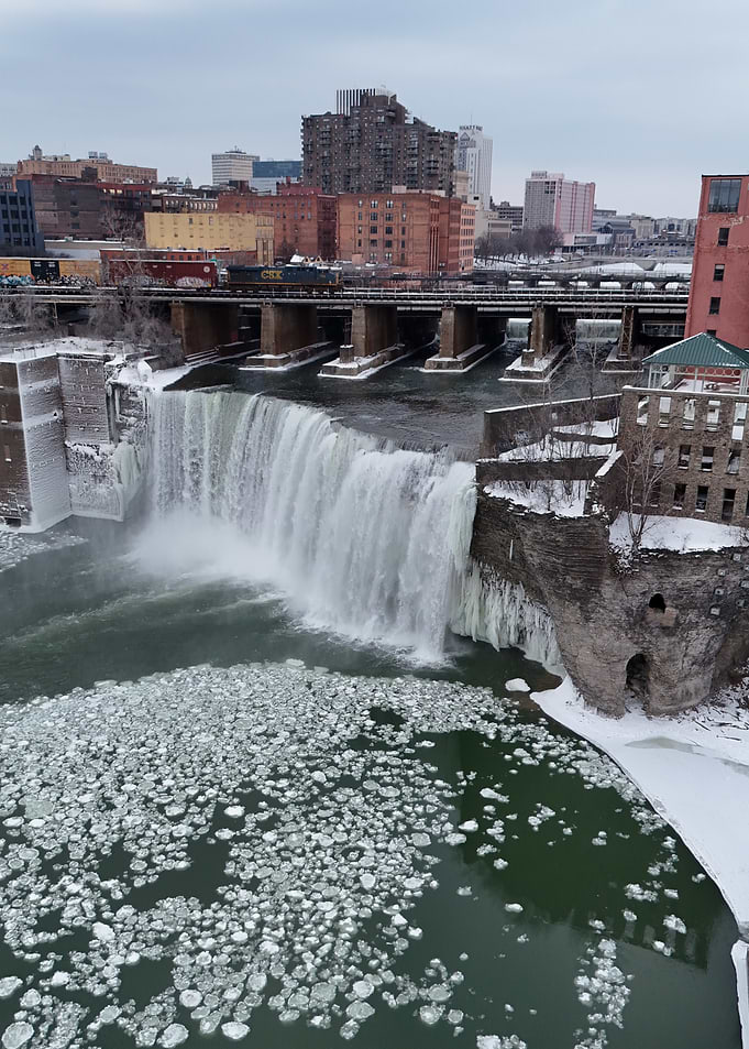 Frozen Waterfall Cityscape with train passing through